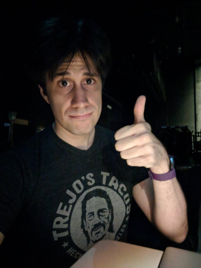 Right before hitting the stage. Wearing Danny Trejo because I feel like a superhero when I do. Click for full size.